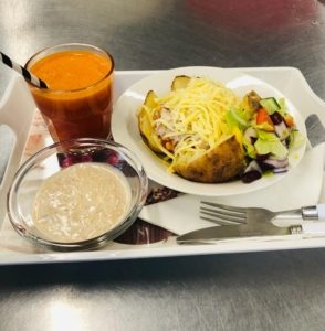 Picture of jacket potato with juice and dessert